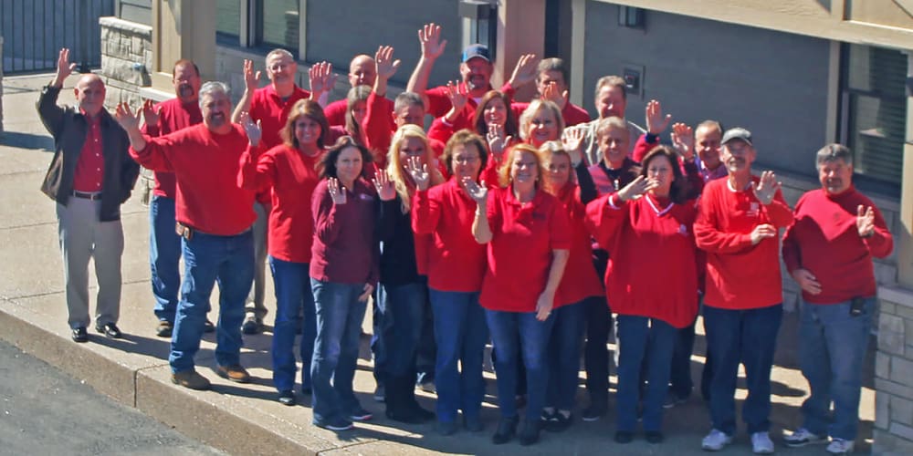 Allen Roofing and Siding employees in red shirts